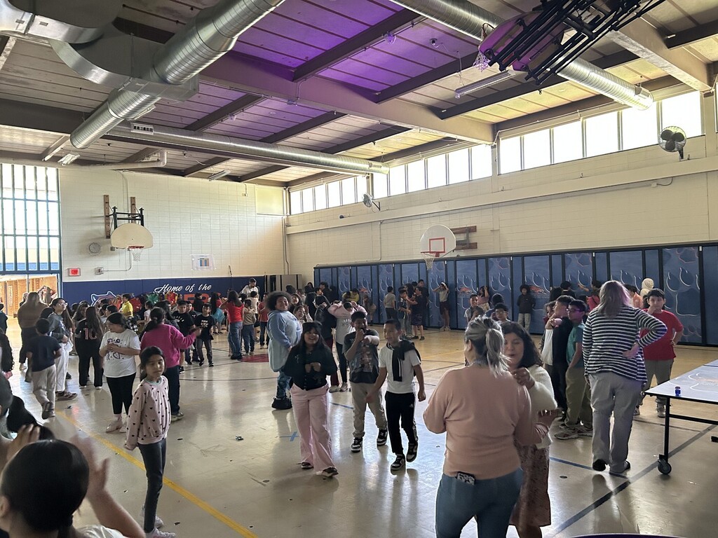 Students and Staff at school's gym celebrating MAP Dance Party