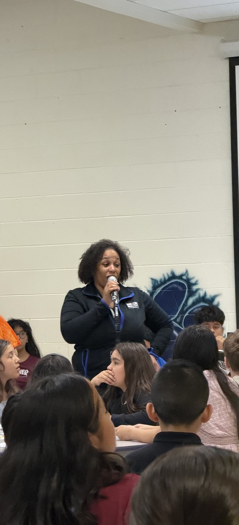 Ms. Myers talking to students
