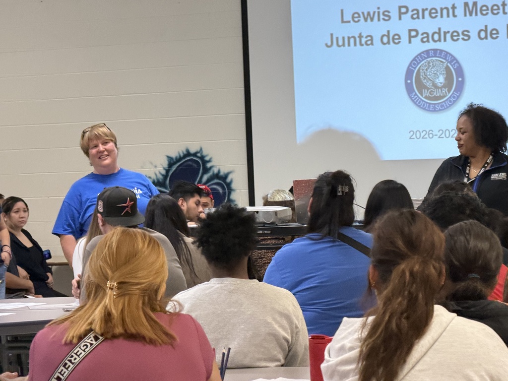Ms. Schaefer and Ms. Myer talking to parentsi