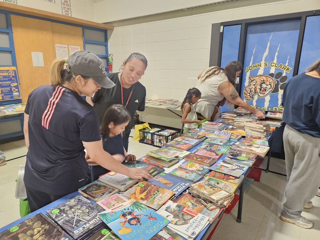Meet and Greet: Families look through books to take home. 