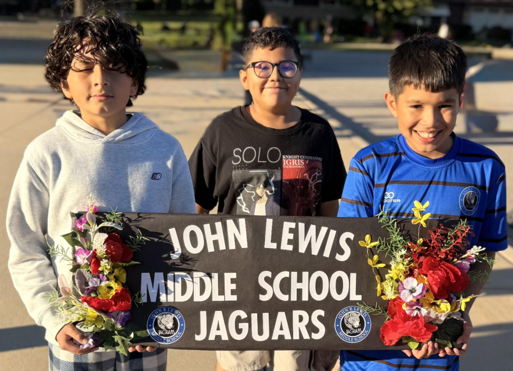 Lewis Students with sign