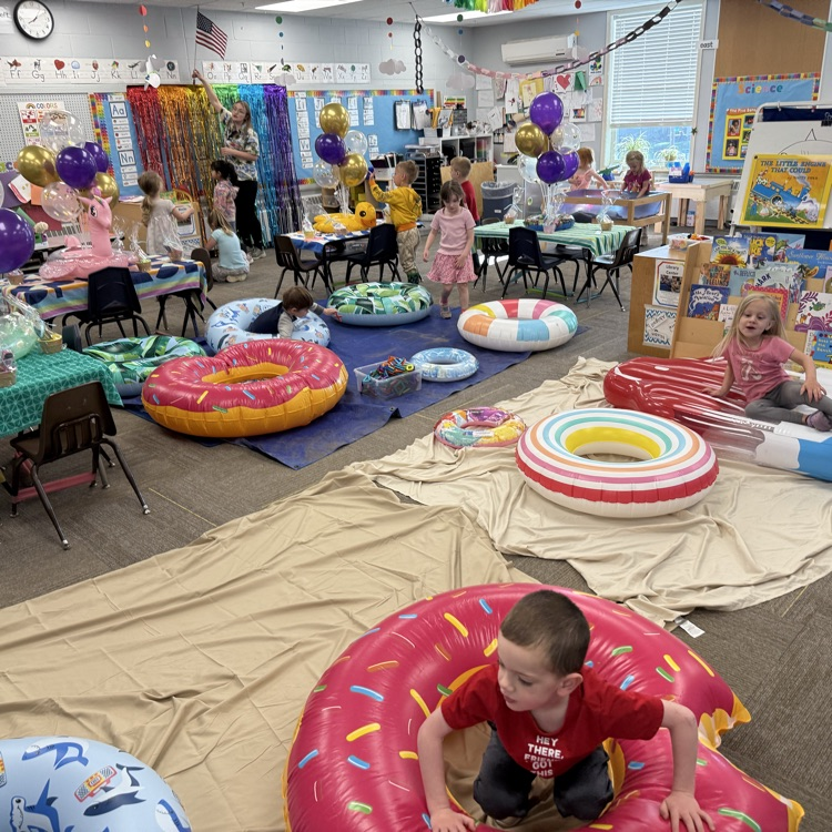 preschool room in a beach theme with students playing