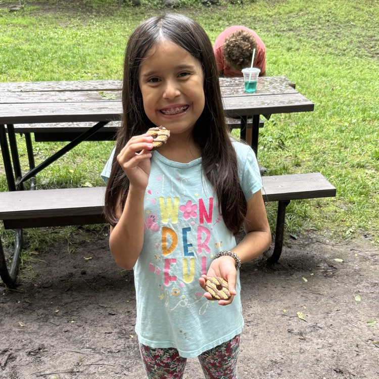 the student is eating a s'more