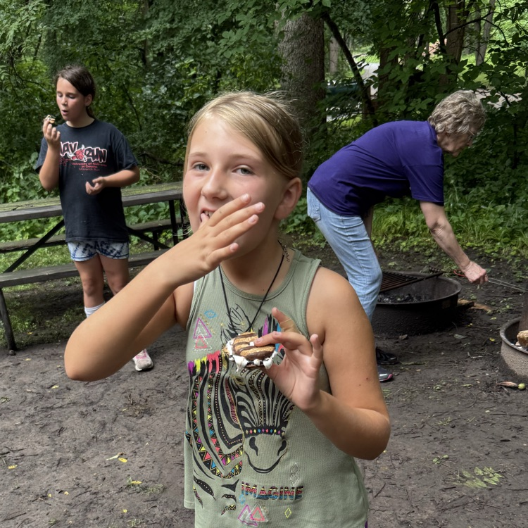 the student is eating a smore