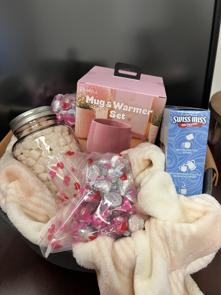 Pink out basket with candy and mugs