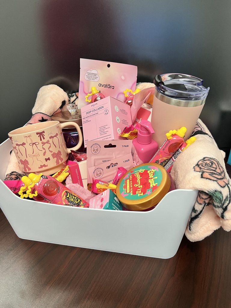 Pink out basket with candy and mugs