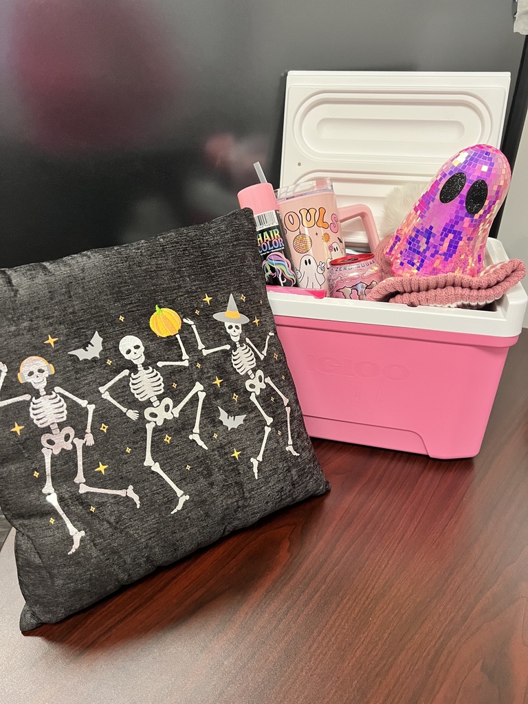Pink out basket with candy and mugs