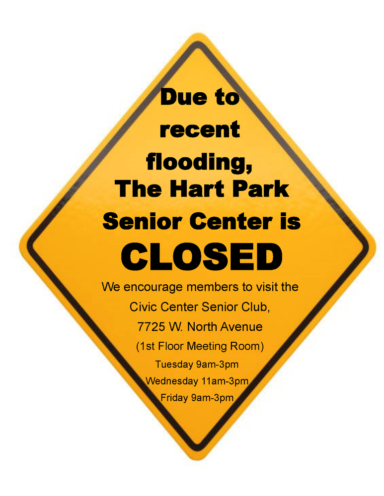 Yellow Caution sign with message about Hart Park Senior Center being closed indefinitely