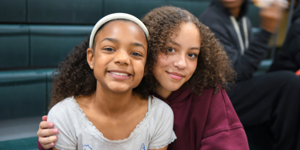 student mentor smiling with her student mentee