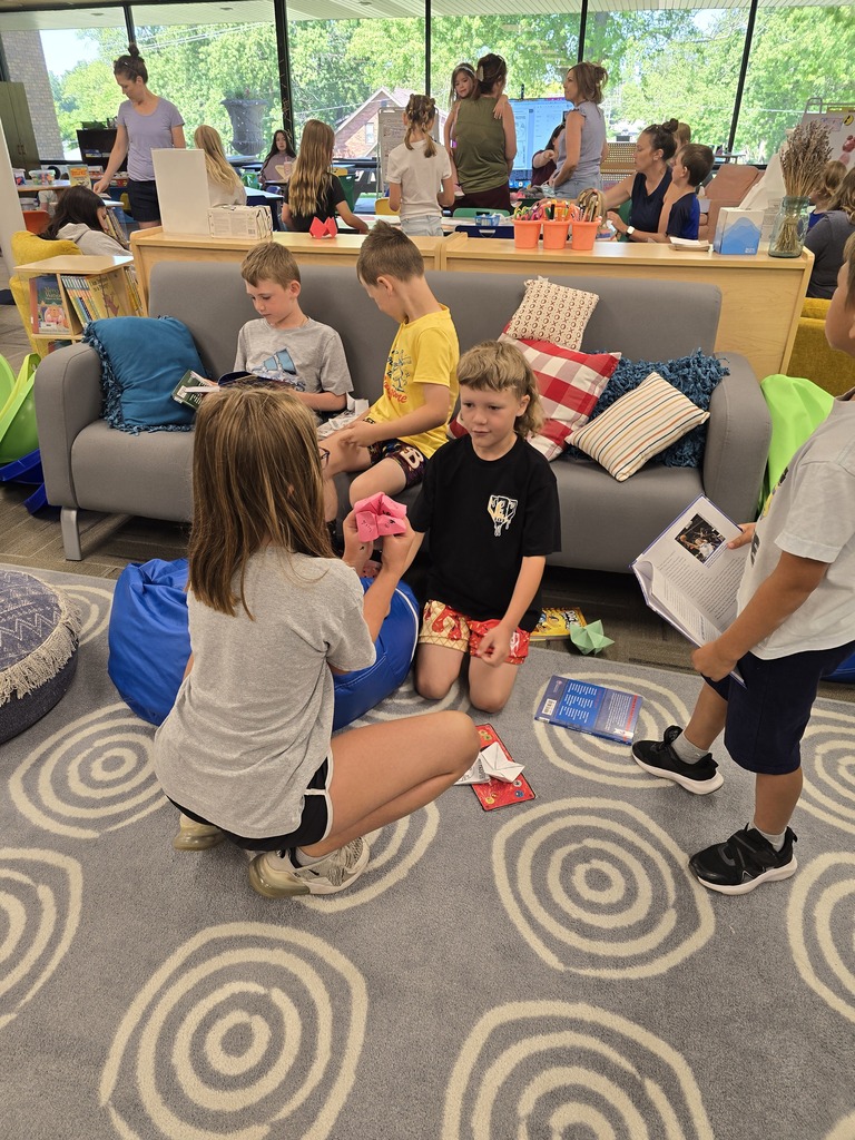 Summer reading-playing origami game and reading on couch