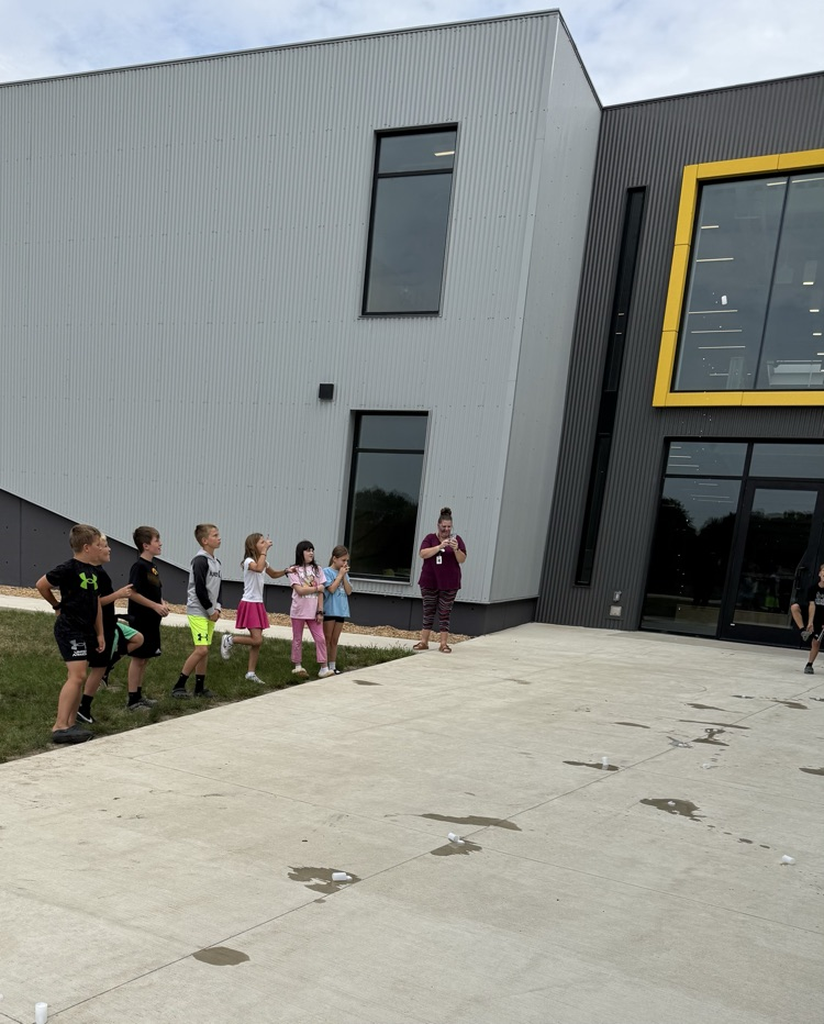 Students watching film canister rocket launch