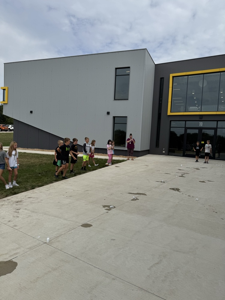 students watching a film canister rocket launch