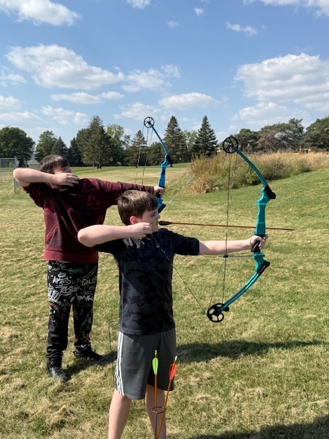 Students showing off thier archery skills