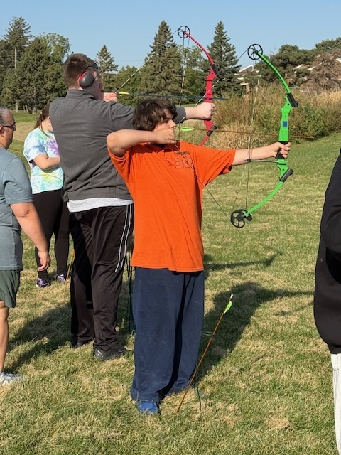 Students showing off thier archery skills