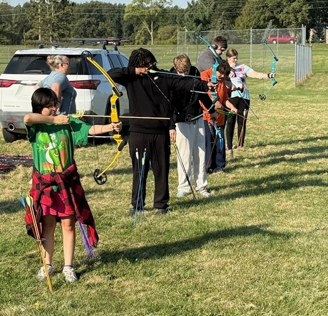 Students showing off thier archery skills