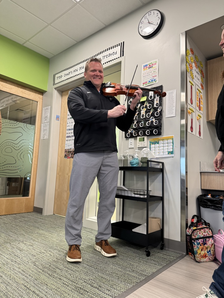 Mr Parker tries a violin