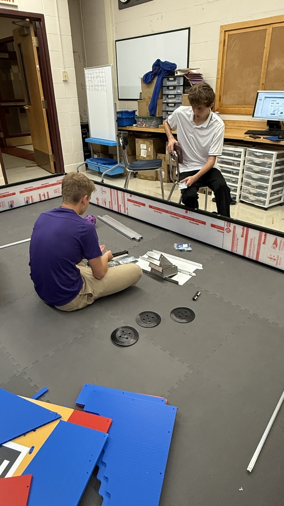 Tosh and George assemble part of the competition field