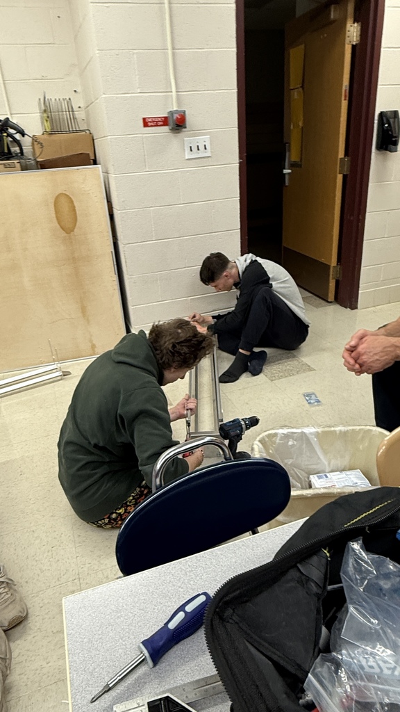 Elijah Orlicki and Owen Roberts assemble part of the competition field.