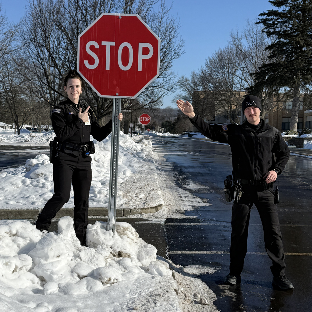Officers VanDunk and Terry remind us to STOP at the sopt signs.