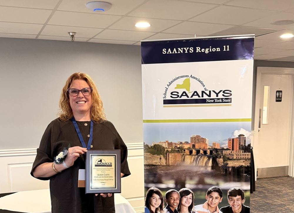 Alison Cantu holds an award she won from SAANYS