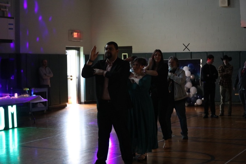 FLSS Students dance in a dark gymnasium at Prom