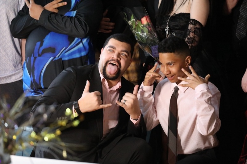 A staff member and student pose for a photo at FLSS Prom