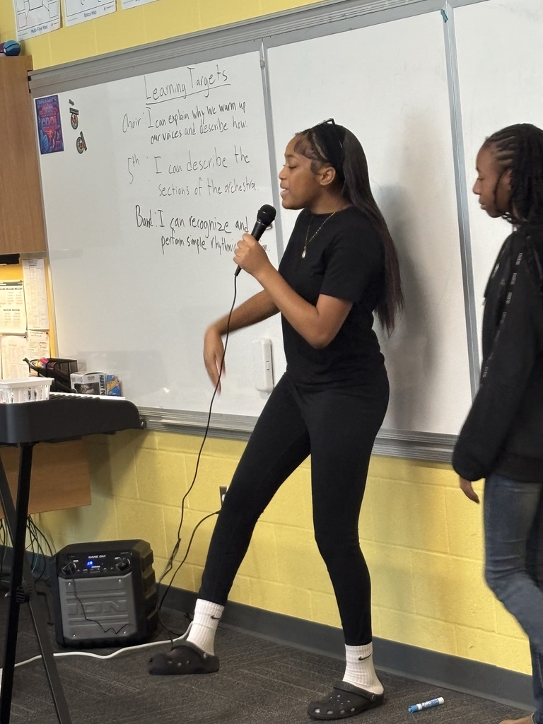 SCM choir students performing for their peers.