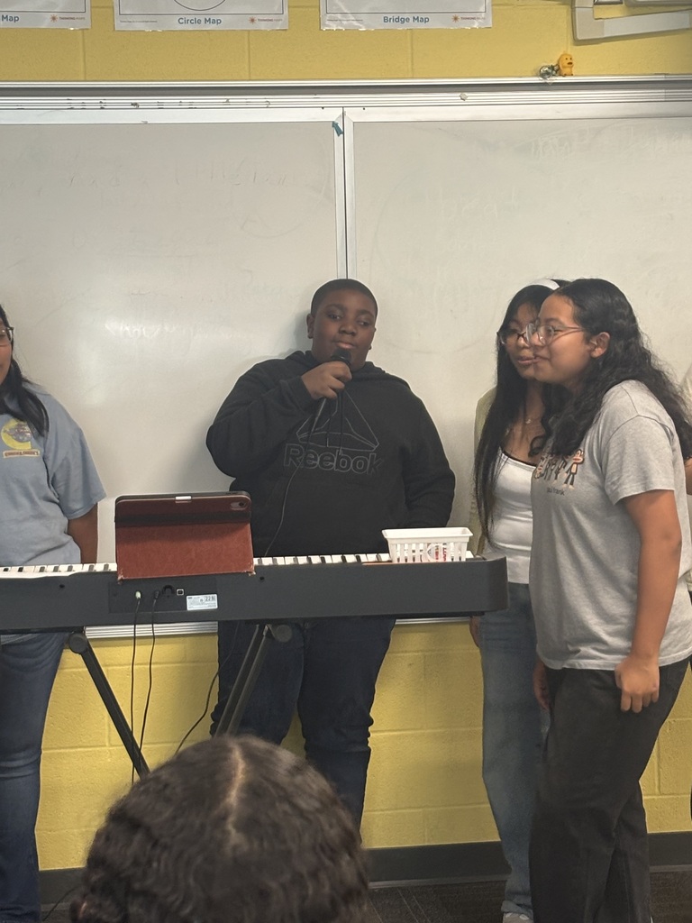 SCM choir students performing for their peers.