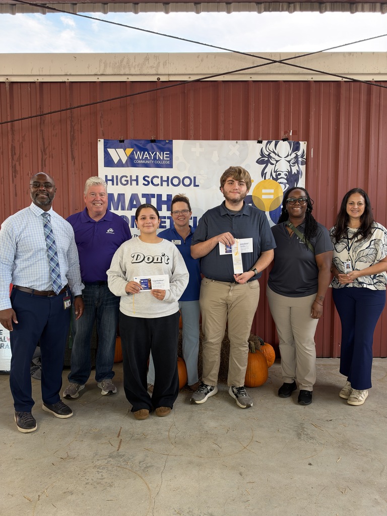 Our two second place winners holding their ribbons and our Principal and Math teacher along with Fair staff.