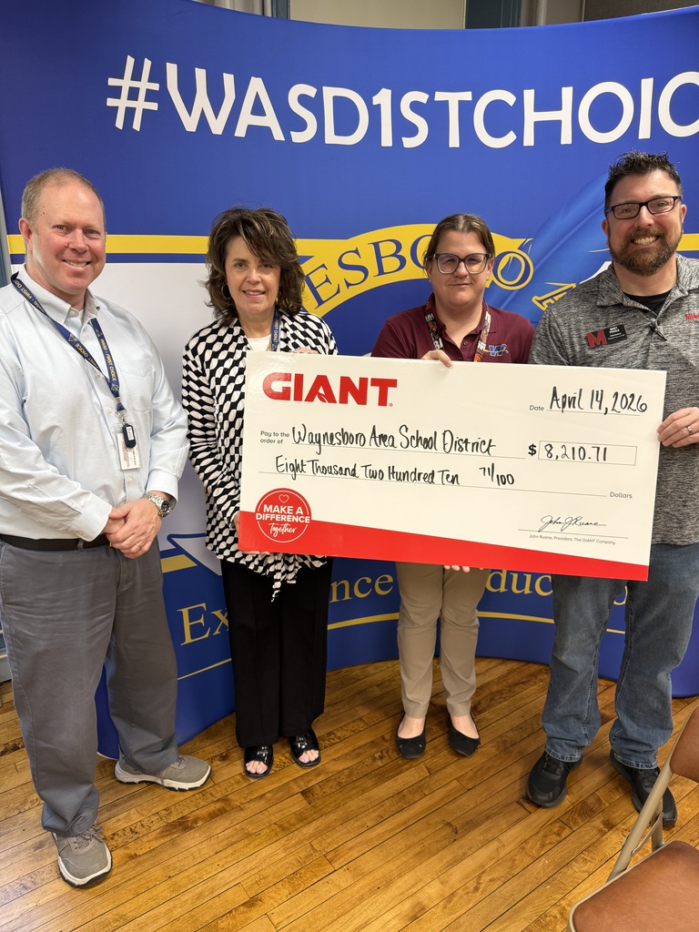 The Giant Corporation presentign a check to the district