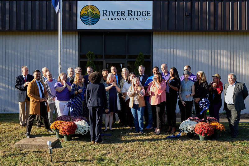 Mrs. Christian Cutting Ribbon