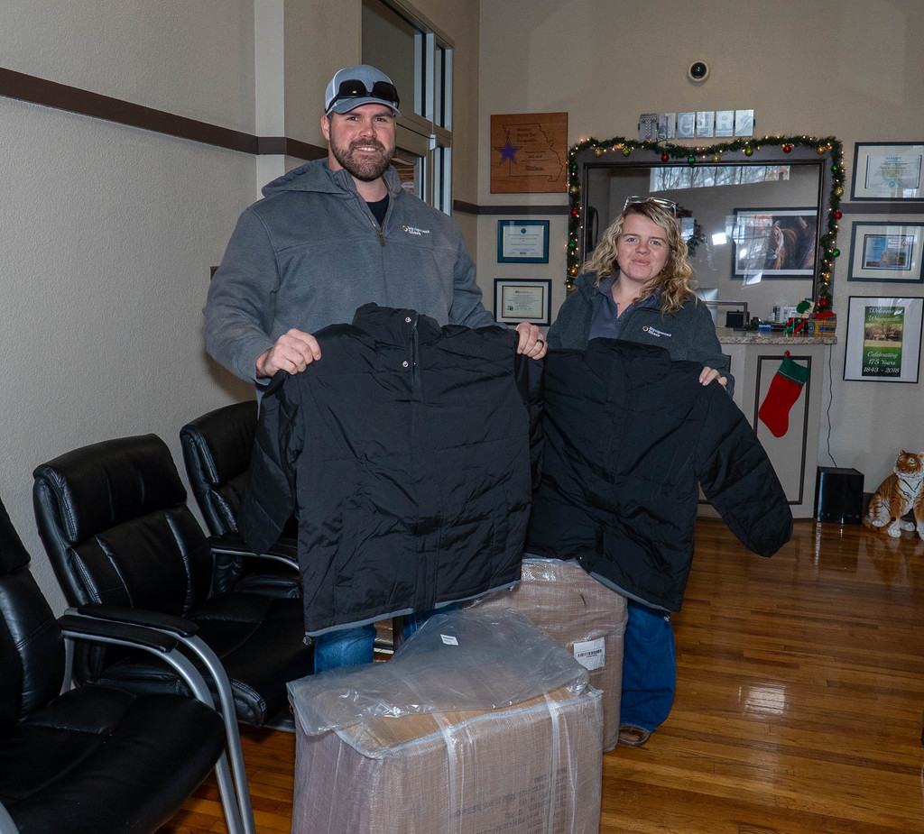 Equipment Share of Lebanon, Mo., generously donated more than two dozen new coats for Waynesville R-VI students on Dec. 3, 2025. Shown delivering the coats are General Manager Sawyer Padgett and Territory Account Manager Kaitlynn Black of Equipment Share.