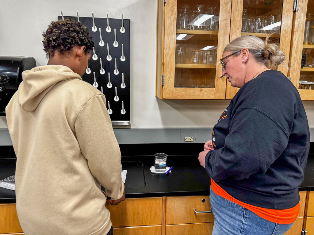 To review their learning standards, 8th graders rotated through stations, tackling questions that pushed them to sort and classify items like true scientists in Kelly Jackson’s science class at Waynesville Middle School. Stations were filled with everyday items—an aluminum cube, an empty can, rusty metal, baking soda, fruit, gelatin, cereal, pasta and beans, sand, sugar water, melted crayons, and even air trapped in a balloon. At each stop, they answered questions such as: · Is it a metal, substance or mixture? How do you know? · Is it heterogeneous or homogeneous? · Is it an element or compound? · What variations make this easily categorized? · How is a colloid different from a suspension? This hands-on learning turned simple objects into a real-world learning experience.