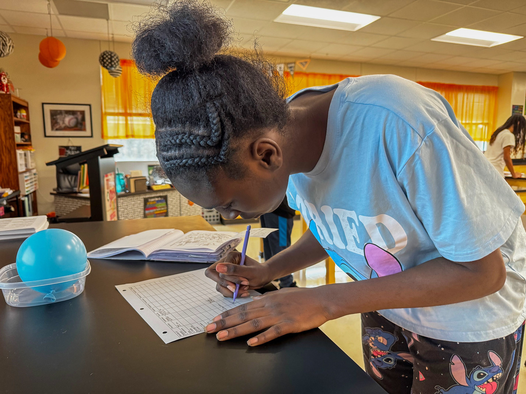 To review their learning standards, 8th graders rotated through stations, tackling questions that pushed them to sort and classify items like true scientists in Kelly Jackson’s science class at Waynesville Middle School. Stations were filled with everyday items—an aluminum cube, an empty can, rusty metal, baking soda, fruit, gelatin, cereal, pasta and beans, sand, sugar water, melted crayons, and even air trapped in a balloon. At each stop, they answered questions such as: · Is it a metal, substance or mixture? How do you know? · Is it heterogeneous or homogeneous? · Is it an element or compound? · What variations make this easily categorized? · How is a colloid different from a suspension? This hands-on learning turned simple objects into a real-world learning experience.