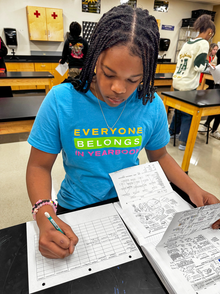 To review their learning standards, 8th graders rotated through stations, tackling questions that pushed them to sort and classify items like true scientists in Kelly Jackson’s science class at Waynesville Middle School. Stations were filled with everyday items—an aluminum cube, an empty can, rusty metal, baking soda, fruit, gelatin, cereal, pasta and beans, sand, sugar water, melted crayons, and even air trapped in a balloon. At each stop, they answered questions such as: · Is it a metal, substance or mixture? How do you know? · Is it heterogeneous or homogeneous? · Is it an element or compound? · What variations make this easily categorized? · How is a colloid different from a suspension? This hands-on learning turned simple objects into a real-world learning experience.
