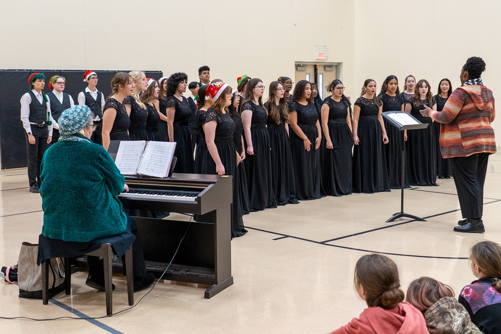 The Waynesville High School Chamber Choir performed holiday tunes before an audience of students at the Waynesville Sixth Grade Center on Dec. 12, 2025. 