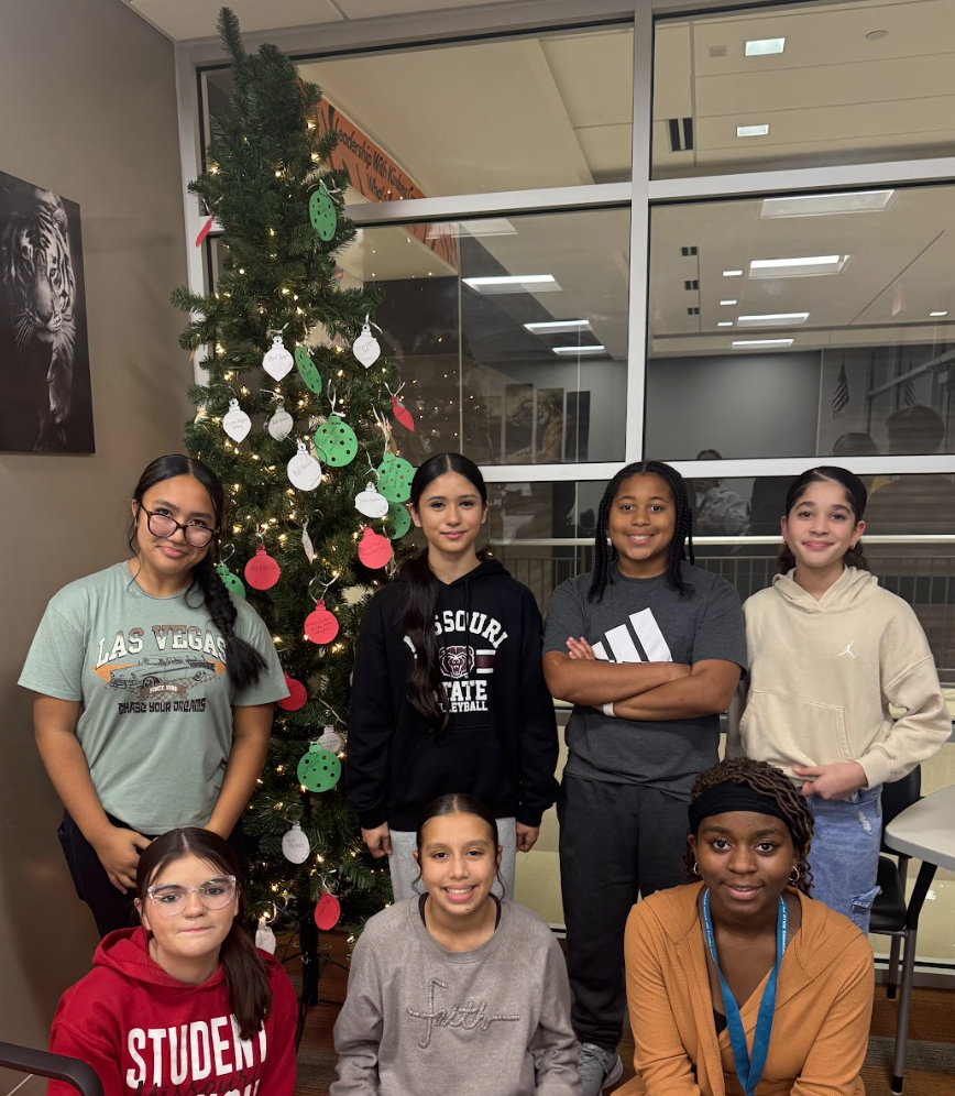 Before the holiday break, Waynesville Middle School Student Council members assisted with organizing and decorating a giving tree, fundraising for gifts, shopping for their peers and wrapping the presents. They helped make the holidays a little brighter for 17 of their peers.