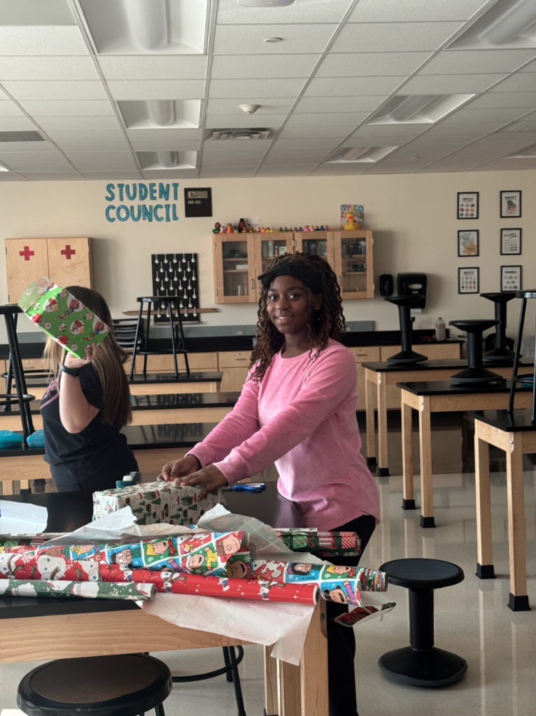 Before the holiday break, Waynesville Middle School Student Council members assisted with organizing and decorating a giving tree, fundraising for gifts, shopping for their peers and wrapping the presents. They helped make the holidays a little brighter for 17 of their peers.