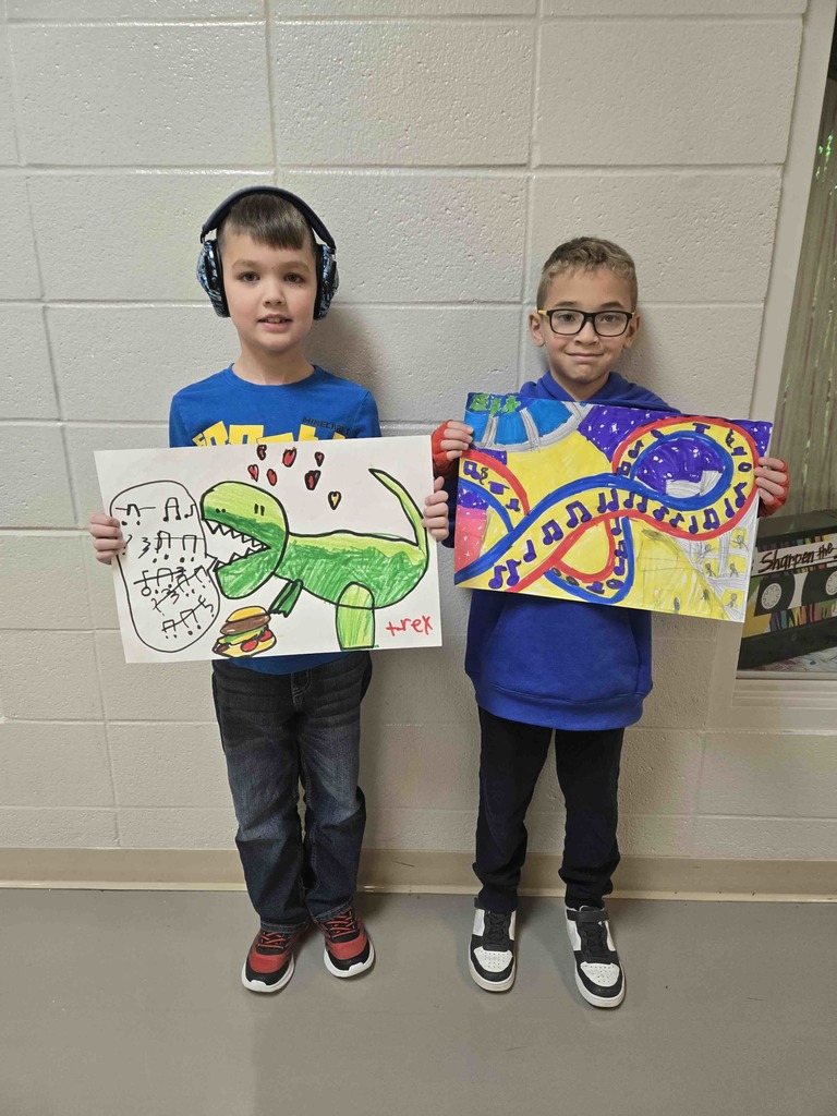 John Stephens and Aiden Brown are pictured with their award-winning artwork.