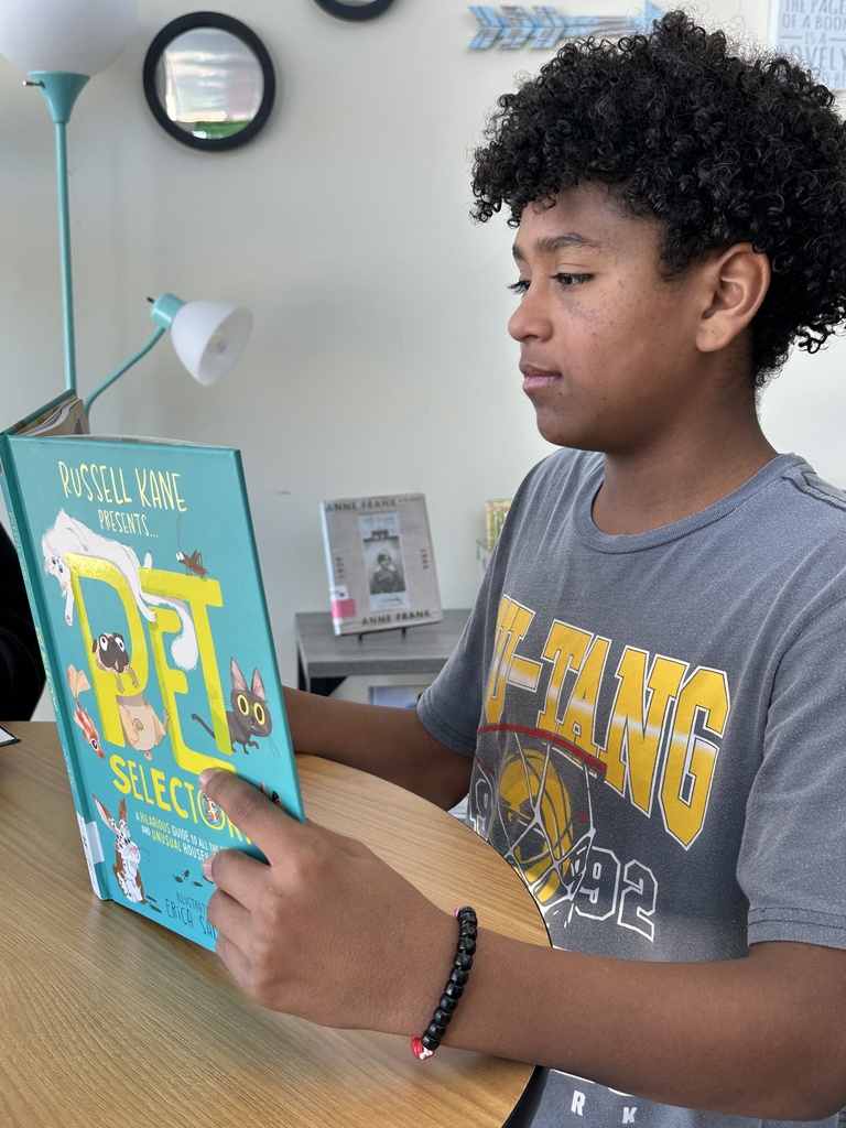 Student reading in library