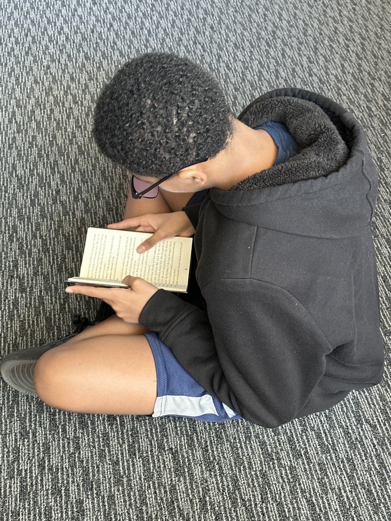 Student reading in library