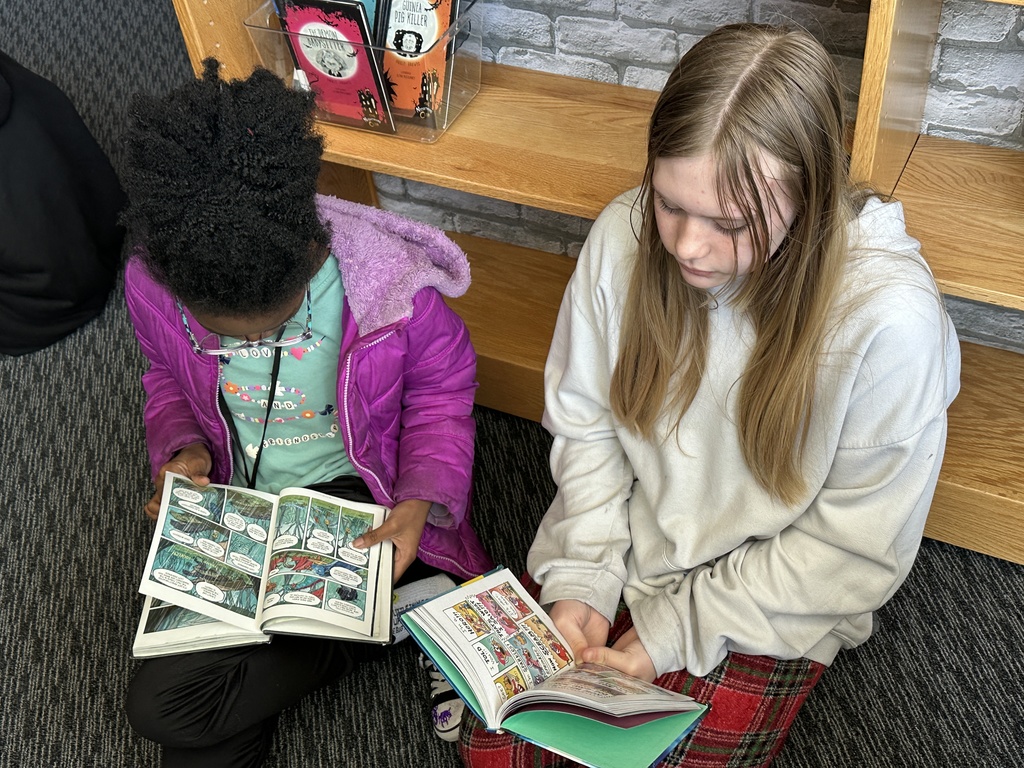Student reading in library