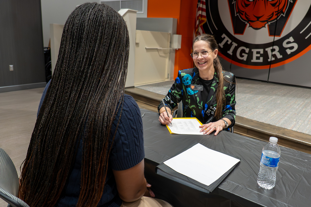 An applicant participates in screening interview
