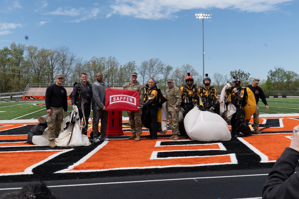 Holding a flag marking the beginning of the Sapper Competition