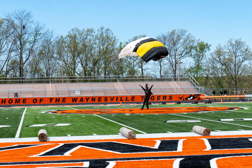Weat Point Parachute Team landing in Tiger Stadium 