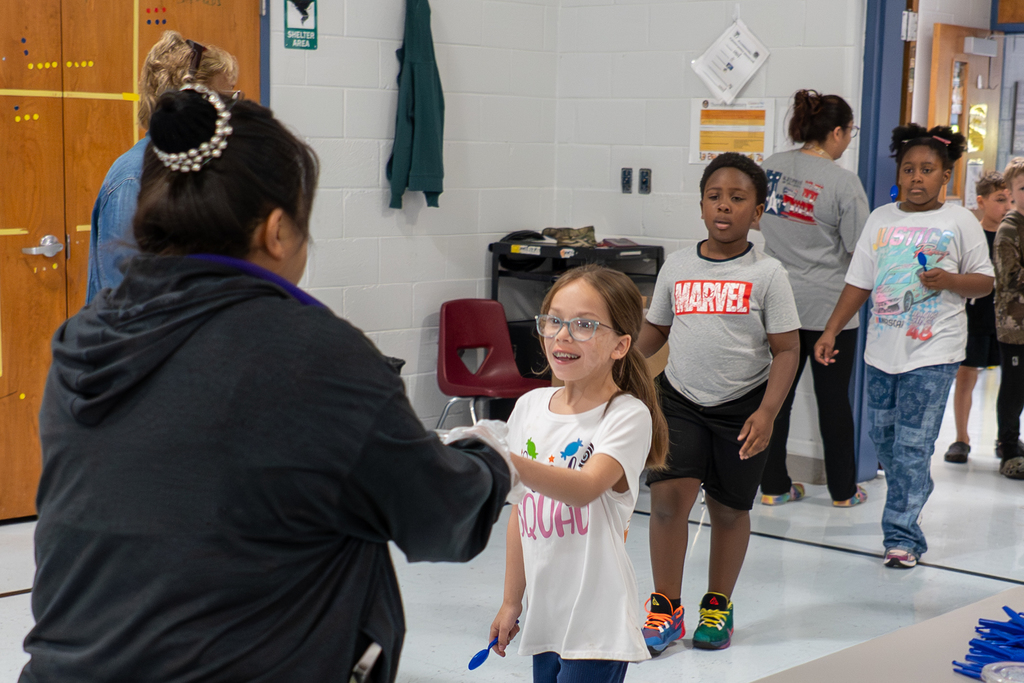 Volunteers handing out custard