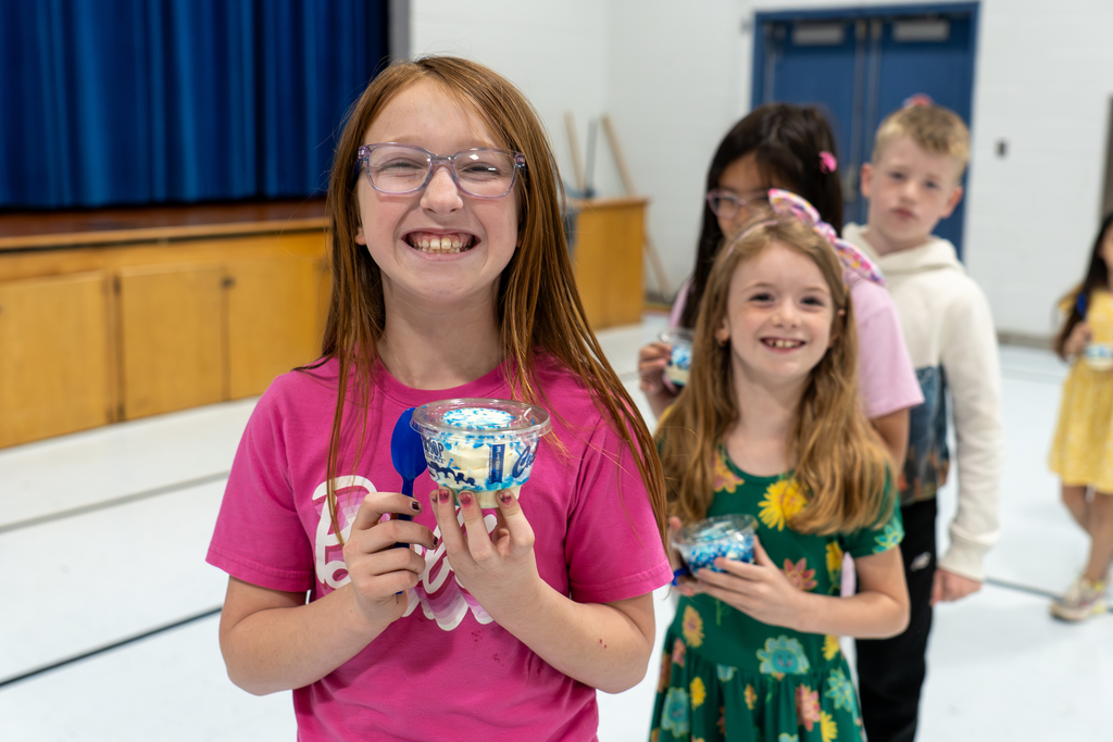 Volunteers handing out custard