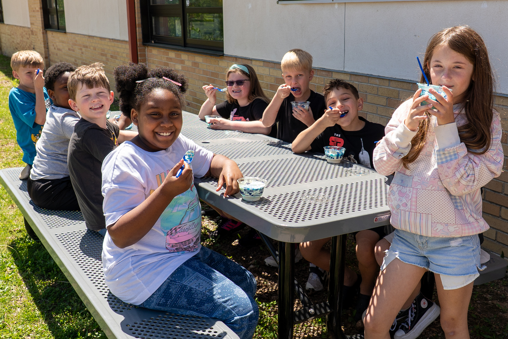 Students eating custard