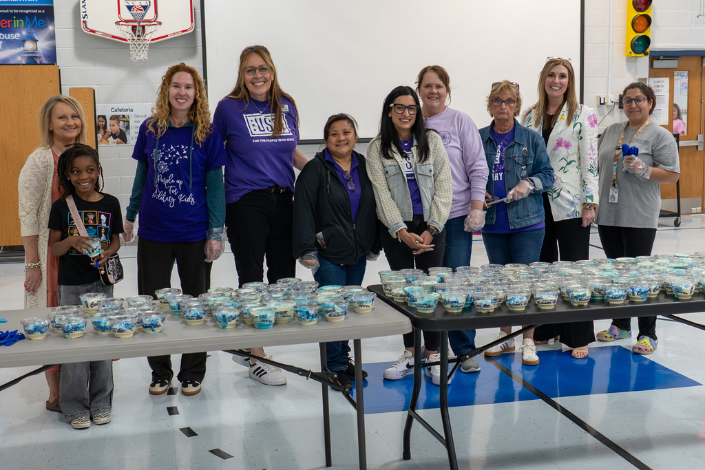 Volunteers serving custard