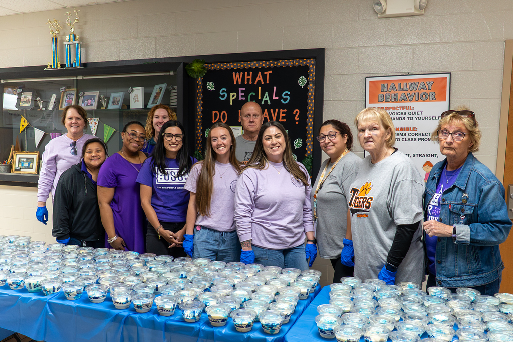 volunteers serving custard